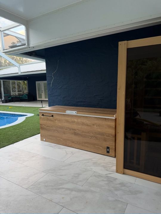 Prestige Cold Plunge Medium — walnut wrap, outdoor pool setting